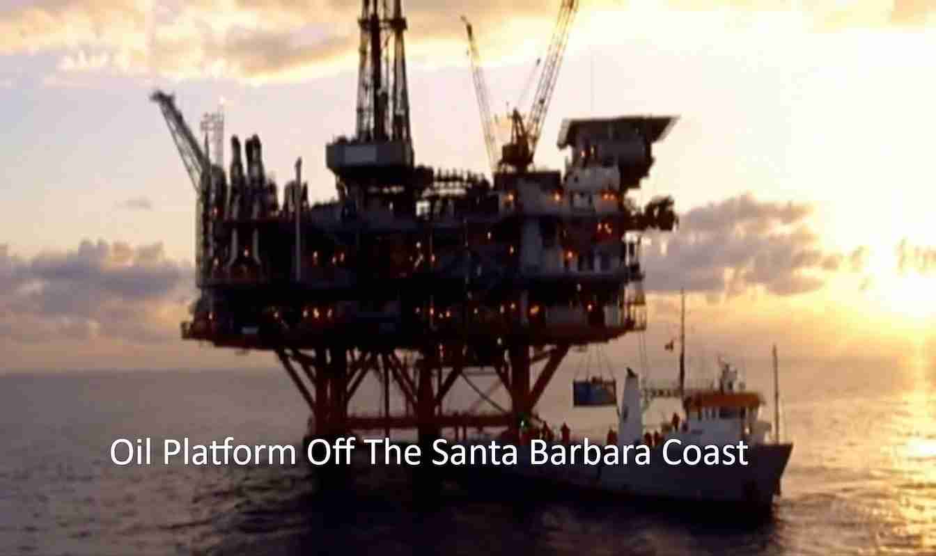 Offshore oil platform on tall legs at sunset, with a support vessel nearby; caption reads 'Oil Platform Off The Santa Barbara Coast'.