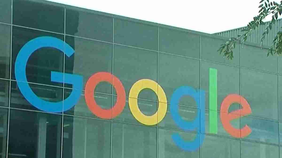 Google logo in blue, red, yellow, and green on a glass office building facade